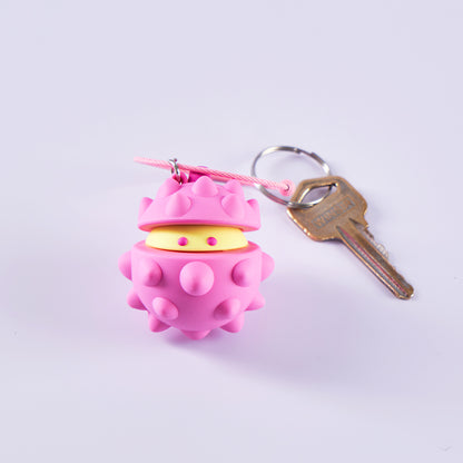 Pink Bella 3D durian keychain attached to keys for scale; keys are styling props.
