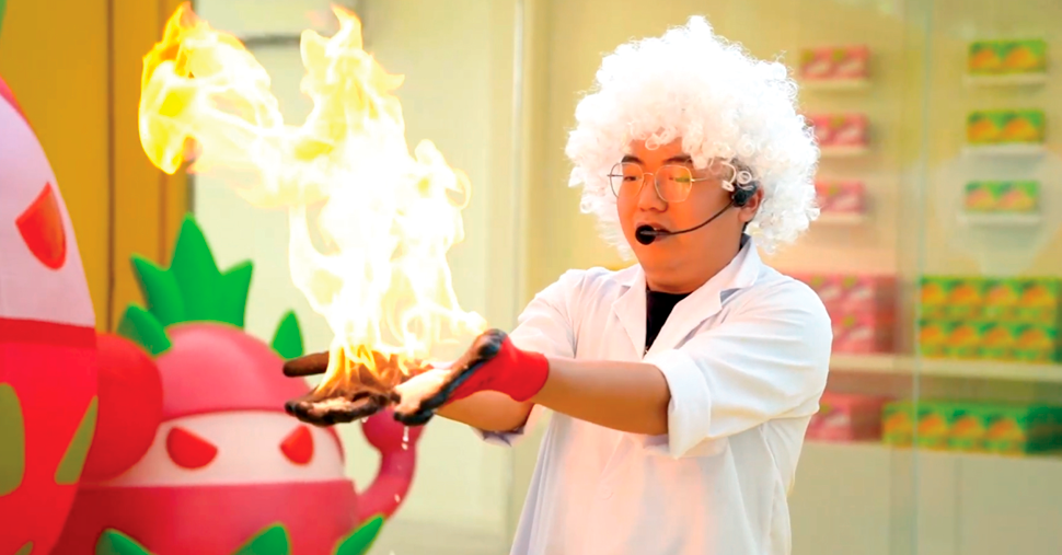 White hair man hand on fire, magic show