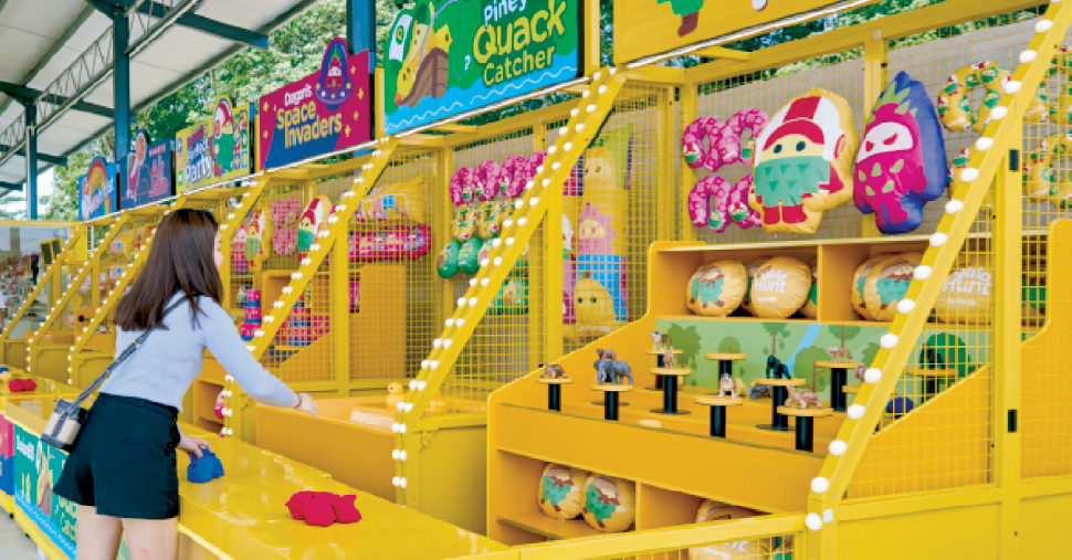 A girl playing carnival game