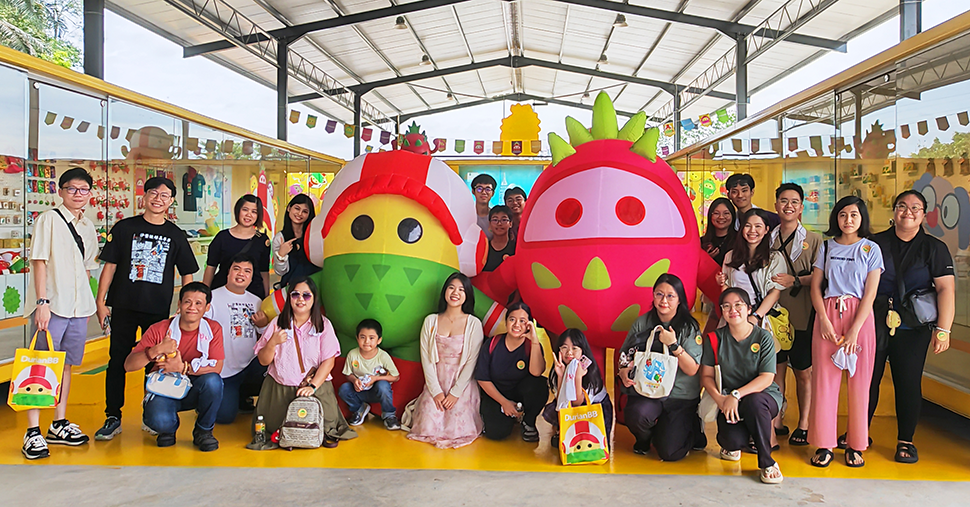 A group of people with SuperB and Dragon mascot