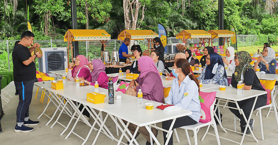 A group of people sitting joining class